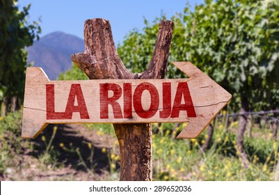 Rioja Wooden Sign With Vineyard Background