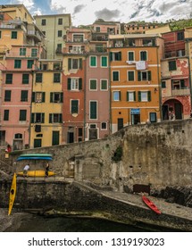 Riomaggiore, Cinque Terre, Italy - 26 June 2018: People Undocking A Kayak Boat At Cove Of Riomaggiore, Cinque Terre, Italy