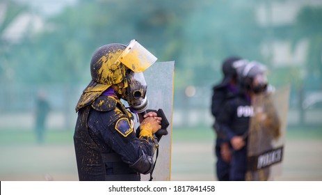 Riot Police Practice Crowd-control Scenarios From Protesters Throwing Officers With Paint.