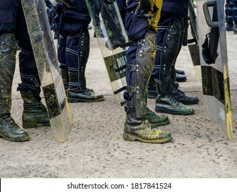 Riot Police Practice Crowd-control Scenarios From Protesters Throwing Officers With Paint.