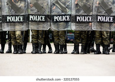 Riot police woman - Shutterstock ID 320137055