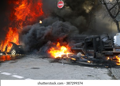 Riots in the city, citizens in conflict with the power harness tires and vehicles police disperse demonstrators in Europe, protesting people fighting for their rights, is also breaking the law - Shutterstock ID 387299374