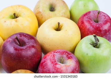 Ripe apples assortment different types. Macro view organic apple fruits red yellow green color. Macro view