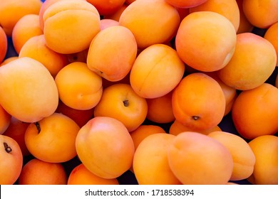 Ripe apricots fruit on a street fruit vegetables market, ecological food, background - Powered by Shutterstock