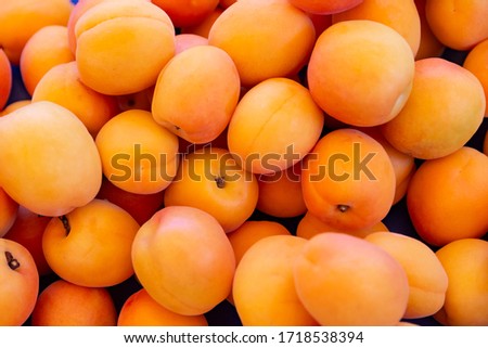 Ripe apricots fruit on a street fruit vegetables market, ecological food, background