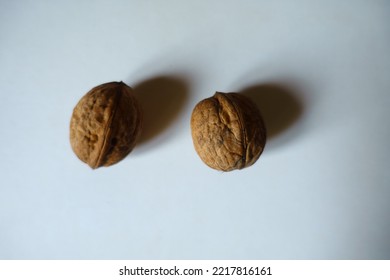 Ripe Brown Rounded Wrinkly Fruits Of Persian Walnut (two Items)