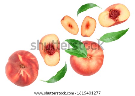 Ripe chinese flat peach fruit and half with leaf isolated on white background with copy space for your text. Top view. Flat lay