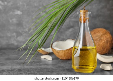 Ripe Coconut And Oil In Bottle On Table. Healthy Cooking