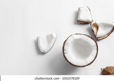 Ripe coconut on white background, top view
