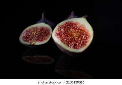 Ripe Figs On A Black Background. Fresh Edible Fig Fruits Of Ficus Carica.