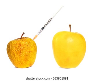 Ripe fresh apple fruit and wrinkled peel apple fruit getting rejuvenation injection procedure. Rejuvenation concept (Aging concept. Botox injection concept). Isolated on a white background - Powered by Shutterstock
