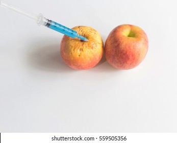 Ripe fresh apple fruit and wrinkled peel apple fruit getting rejuvenation injection procedure. Rejuvenation concept ,Aging and Botox injection concept, isolate on white background
