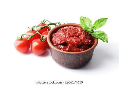 Ripe fresh tomatoes on a white plate, tomato sauce. Cooking ingredient. Fragrant spice green basil. For design.bowl with tomato sauce basil and fresh tomatoes isolated on white background. - Shutterstock ID 2206174639