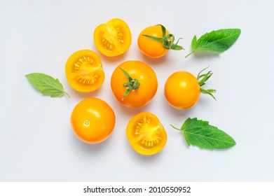 
Ripe fresh yellow orange tomatoes with green tails on light gray background flat lay top view. Cherry tomatoes. Vegetables, healthy vegan organic food, harvest concept tomatoes pattern layout cooking - Powered by Shutterstock