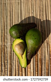 Ripe Green Avocado, Lie On A Reed Mat. View From Above. Harvest Concept. 