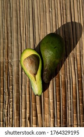 Ripe Green Avocado, Lie On A Reed Mat. View From Above. Harvest Concept.