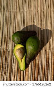 Ripe Green Avocado, Lie On A Reed Mat. View From Above. Harvest Concept.