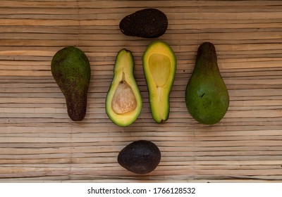 Ripe Green Avocado, Lie On A Reed Mat. View From Above. Harvest Concept.