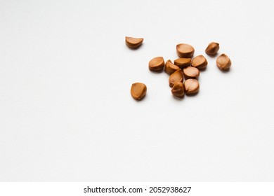 Ripe iris seeds. Scattered on the surface of the table. Space for text. Concept: garden and vegetable garden products, advertising, biology, website design and social networks. - Shutterstock ID 2052938627