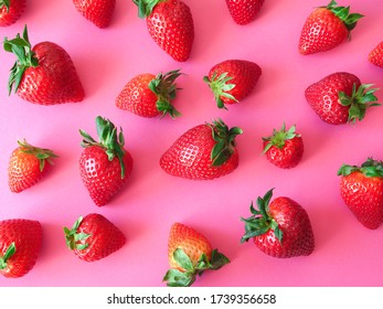 Ripe juicy and fragrant strawberries on a bright pink background - Shutterstock ID 1739356658