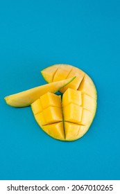 Ripe And Juicy Mango Cut With A Net With A Wedge. View From Above