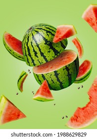 Ripe and juicy watermelon falling in the air isolated on a pastel green background. Creative food concept. Fresh exotic fruit composition. - Shutterstock ID 1988629829