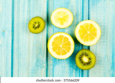 Ripe Lemon, Kiwi Fruit On Wooden Vintage Background. Healthy Vegetarian Food. Recipe, Menu, Mock Up, Cooking.