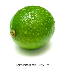 Ripe lime covered by drops of water. Isolation on white. Shallow DOF. - Shutterstock ID 7597129