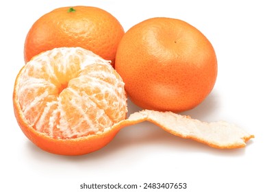 Ripe mandarin fruits and half peeled mandarin isolated on white background.