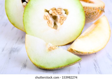 Ripe melons on wooden table close-up - Shutterstock ID 153982274