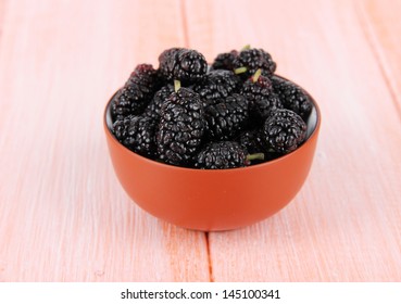 Ripe Mulberries In Bowl On Wooden Background