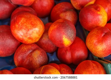 Ripe Nectarines In A Plastic Container. The Concept Of Fortification.