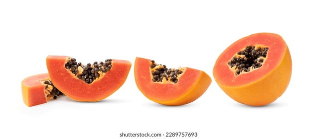 Ripe papaya fruit cut in half isolated on white background