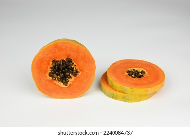ripe papaya slice with seeds isolated on white background - Shutterstock ID 2240084737