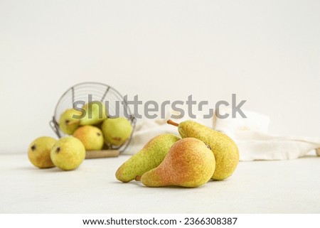 Ripe pears on white background