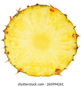 Ripe pineapple slice close up on a white background.