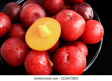 Ripe plums, fresh red plums on dark tone. background of beautiful home plums