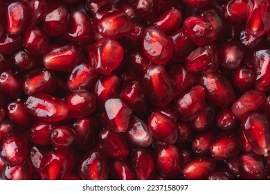 Ripe pomegranate red juicy seeds as a textured background. Close-up. Macro shot - Powered by Shutterstock