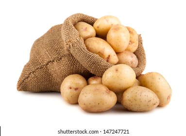 Ripe potatoes in burlap sack isolated on white background