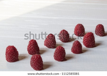 Similar – Frische Himbeeren auf gelbem Hintergrund