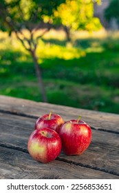 Ripe red apples on wooden background . - Shutterstock ID 2256853651