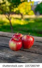 Ripe red apples on wooden background . - Shutterstock ID 2257283749