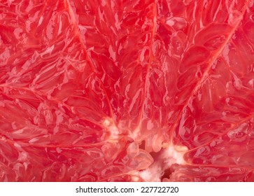 Ripe red grapefruit background close-up - Shutterstock ID 227722720