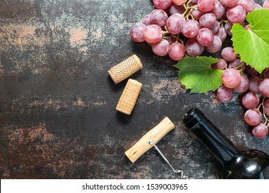  Ripe Red Grapes, Wine Bottles, Corks And Corkscrews On Black Vintage Background With Copy Space For Your Text. Template Food Blog Or Bar Menu. Flat Lay Overhead Composition.