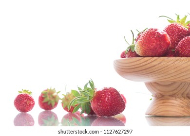 ripe red organic strawberry on a white background - Shutterstock ID 1127627297