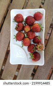 Ripe Red Strawberries On A Square Plate Overhead Shot