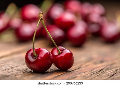 Ripe sour cherry berries on wooden board