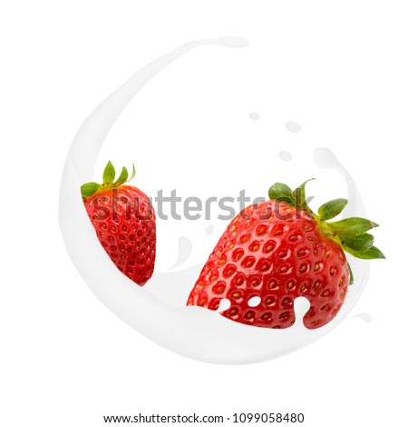 Ripe strawberry in milk splashes on a white.isolated