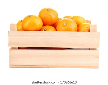 Ripe sweet tangerines in wooden box, isolated on white - Shutterstock ID 173266613