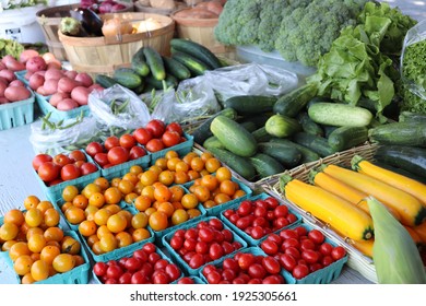 Ripe Tomatoes And Vegetables At Farm Stand  